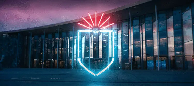 Decorative neon shield outside the student centre at night