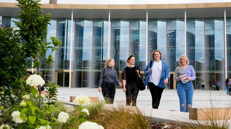 Students walking in the sun.