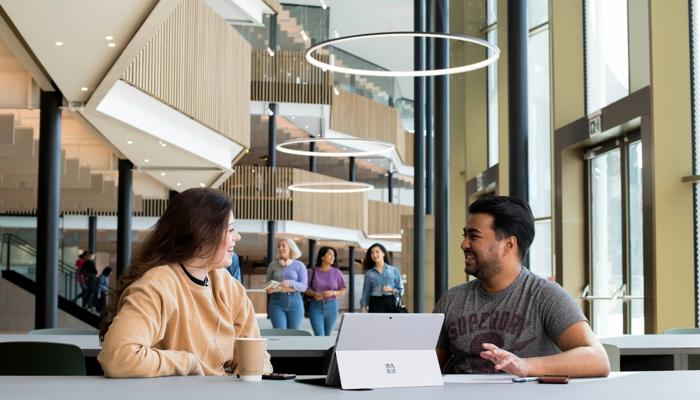 students sat on table discussing