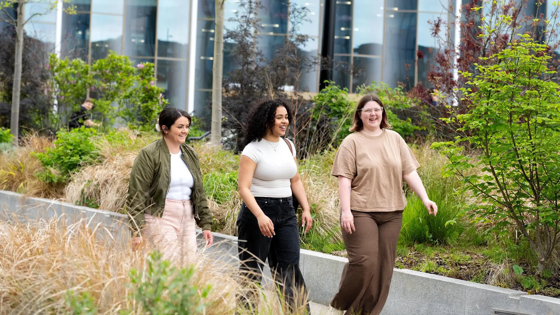 Summer, Kayleigh and Sophie walking outside the Student Centre.