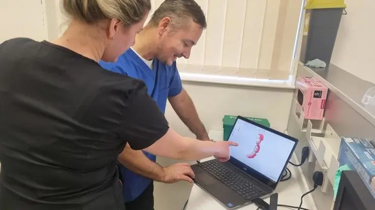 Reviewing intraoral scans to create dental restorations