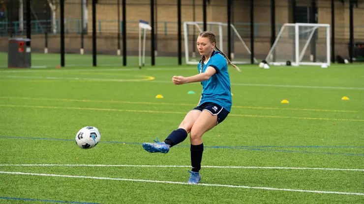 Sports Business Management student on the pitch.