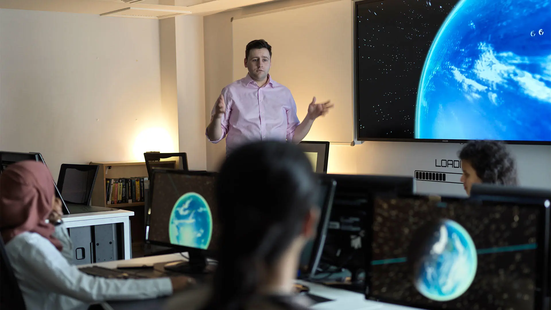 Lecturer teaching a computer development class