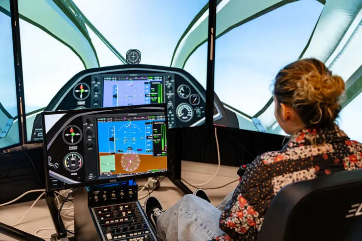 A student using one of the flight simulators