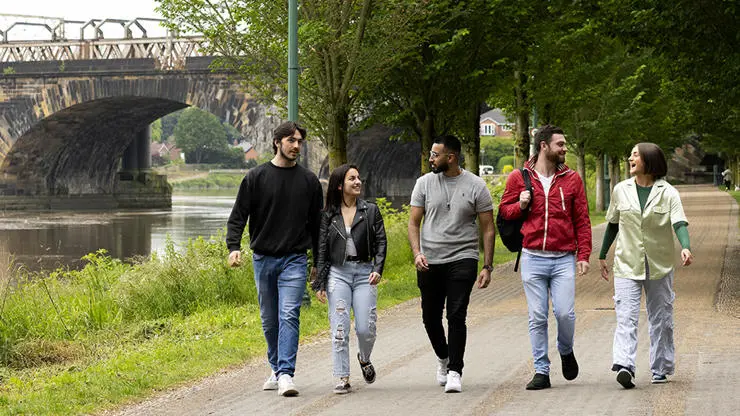 Students walking through Avenham Park.