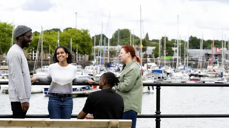 Jane taking part in a photoshoot at Preston Marina alongside other student ambassadors