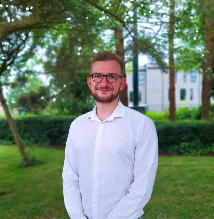 Building Services and Sustainable Engineering Degree Apprentice Sam Kelly outside the PSA offices 