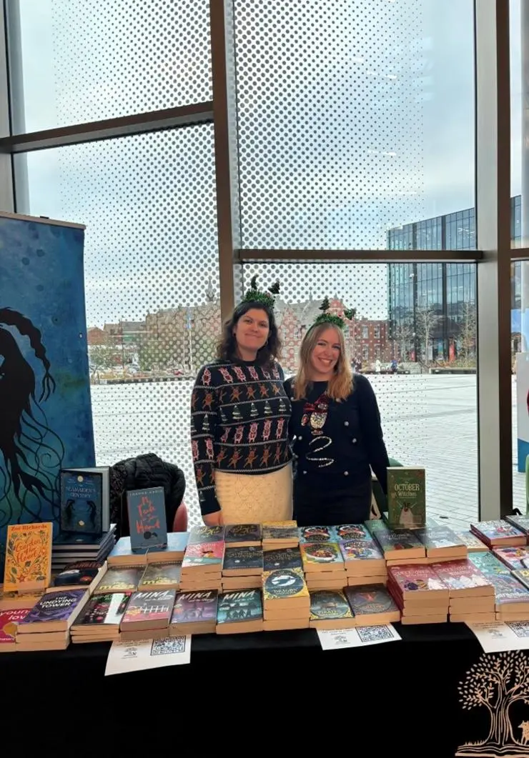 Isobel and classmate Megan at the UCLan Publishing Christmas book stall