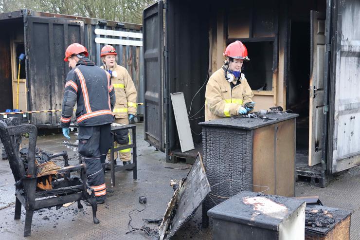 Student working at a fire investigation scene