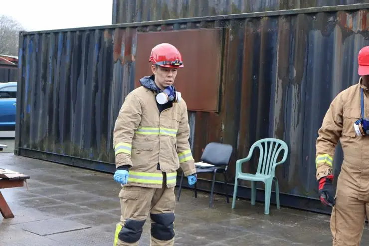 A student arriving at a fire investigation scene