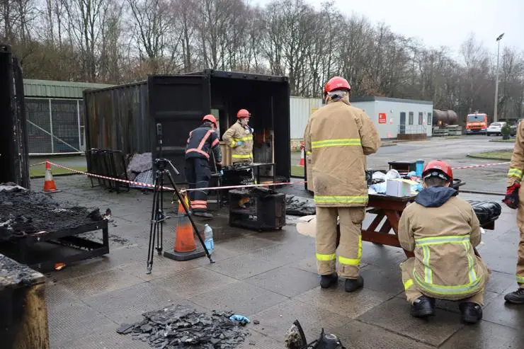 Students working on a fire investigation scene