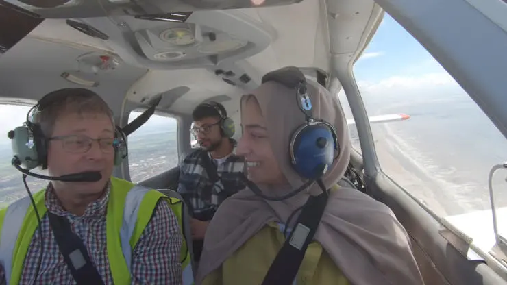 Student flying a plane with an instructor