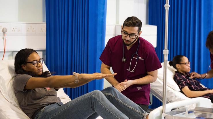 Student assessing patient