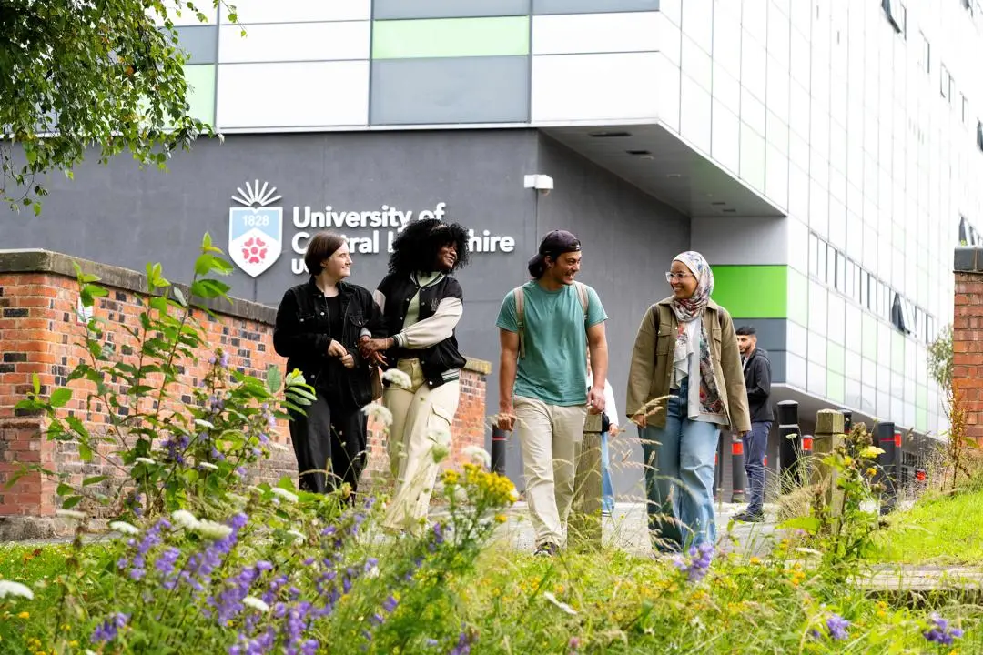 Students walking in front of the Media Factory