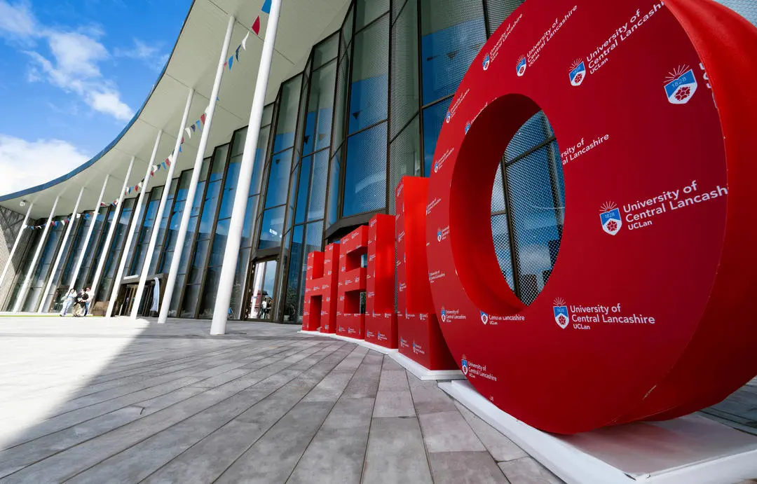 exterior photo of the student centre with big red hello letters