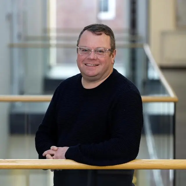 Headshot of Professor Darren Ansell