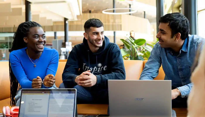 Students using social and study spaces in the student centre