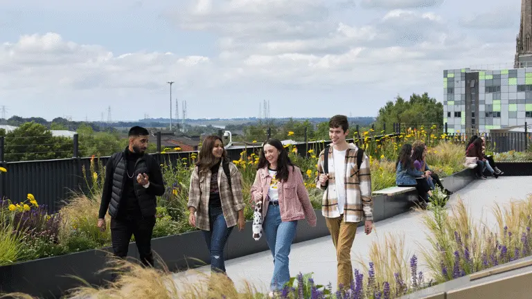 group of students walking on the student centre roof