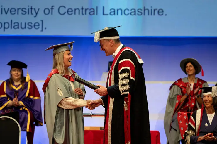 New Honorary Fellow Alex Hartley shaking hands with Professor Graham Baldwin