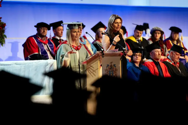 New Honorary Fellow Alex Hartley speaking to the new graduates