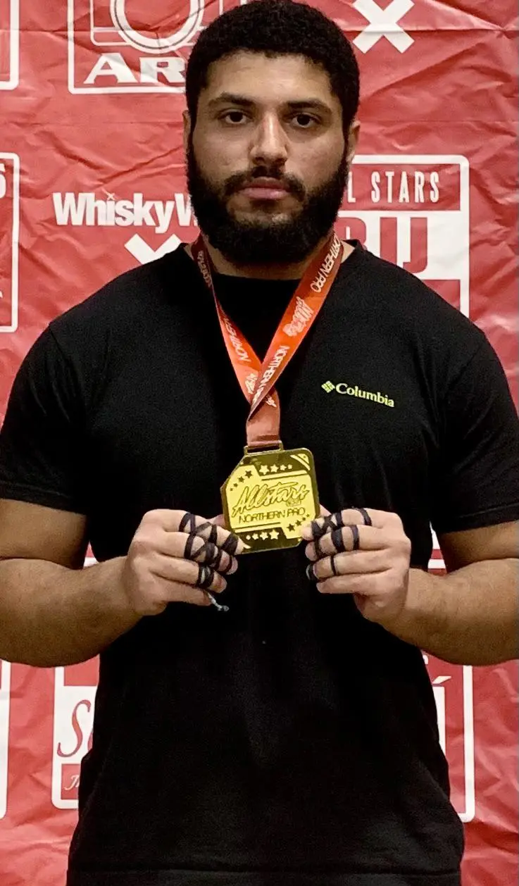 Talal Aldukhayyil with his gold medal around his neck