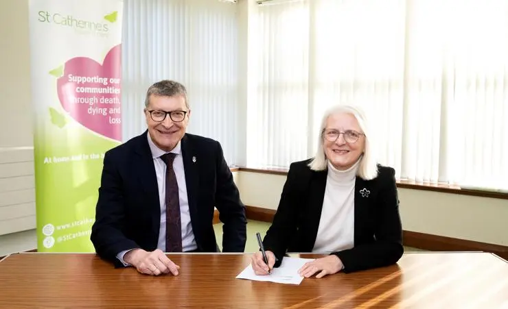 University of Central Lancashire Vice-Chancellor Professor Graham Baldwin and Lorraine Norris, Chair of St Catherine's Hospice, signing the contract